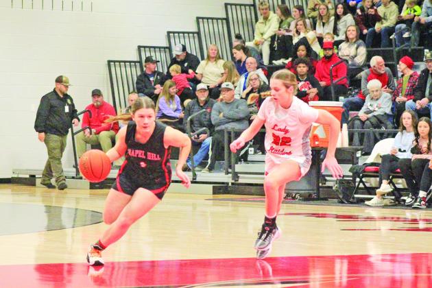 Kaylee Tompkins drives upcourt during Tuesday’s game at Winnsboro. The Lady Devils are 1-2 in their last three games, winning over Winona but falling to rivals Mount Vernon and Winnsboro.