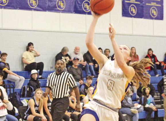 Jaci Caplinger drives for a layup during Harts Bluff’s game against Como-Pickton. The Lady Bulldogs went 1-2 in their final games of 2023 and opened 2024 at New Diana Tuesday afternoon.